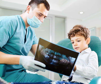 nurse and child teeth x-ray