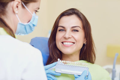 woman having teeth whitening treatment